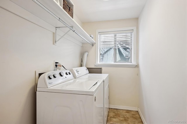 laundry area with washing machine and dryer