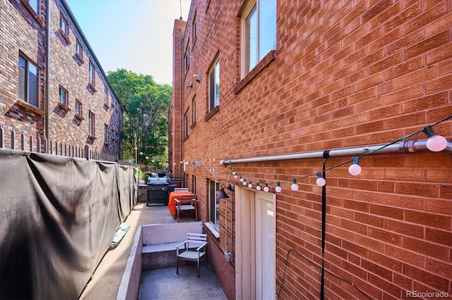 view of side of home featuring a patio