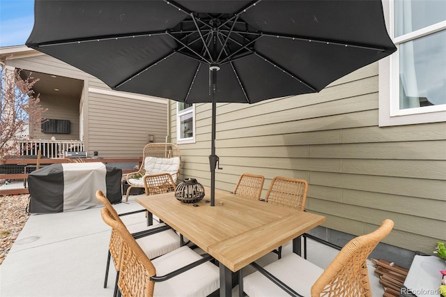 view of patio / terrace featuring outdoor dining area and grilling area