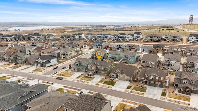 bird's eye view featuring a water view and a residential view
