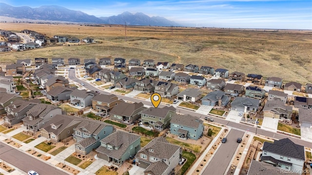 aerial view featuring a mountain view and a residential view