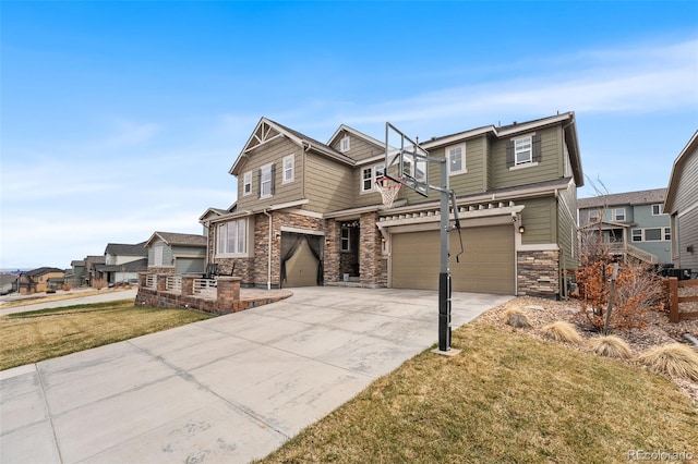 view of front of property with stone siding, a residential view, a garage, concrete driveway, and a front yard