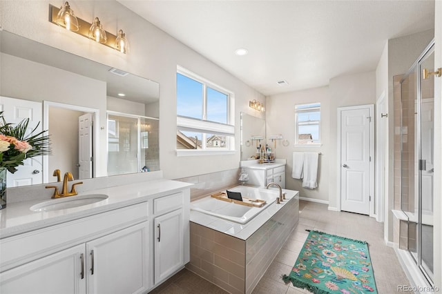 full bathroom with a stall shower, visible vents, tile patterned flooring, a garden tub, and vanity