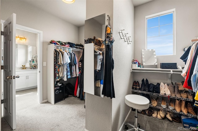 spacious closet with carpet flooring