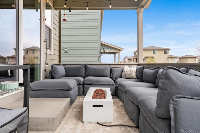 view of patio / terrace featuring an outdoor living space with a fire pit