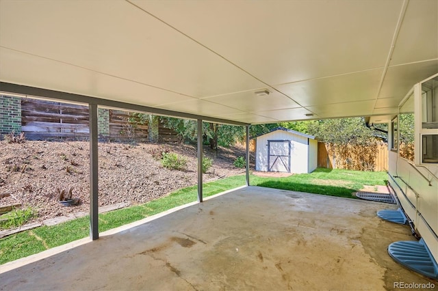 view of patio with a storage shed