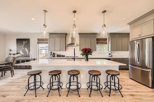 kitchen with freestanding refrigerator, gray cabinets, light countertops, decorative backsplash, and recessed lighting