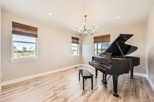 sitting room with a chandelier, baseboards, light wood-style floors, and recessed lighting