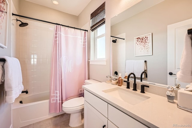 full bath featuring toilet, shower / tub combo, vanity, and tile patterned floors