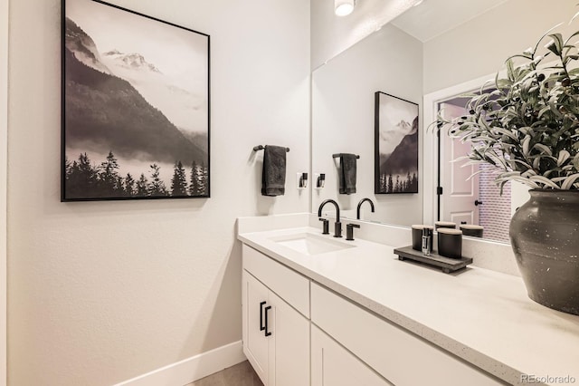 bathroom featuring vanity and baseboards