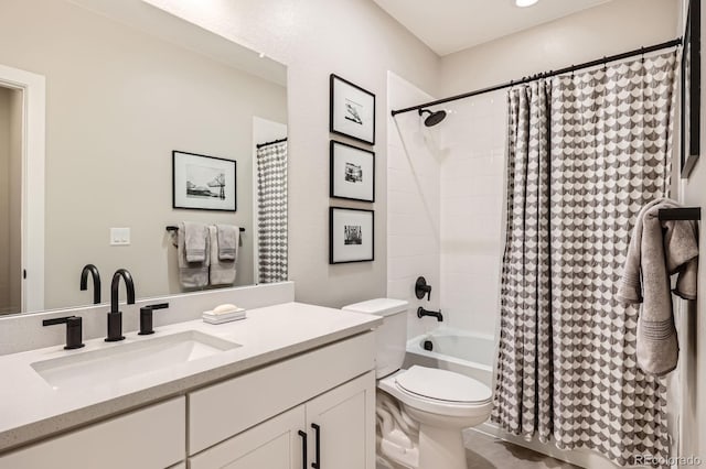 bathroom with toilet, vanity, and shower / bath combo with shower curtain