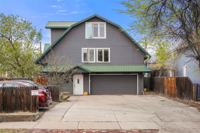 2087 S Grant St, Denver, CO 80210 - rustic home with a gambrel roof, a garage, metal roof, fence, and concrete driveway