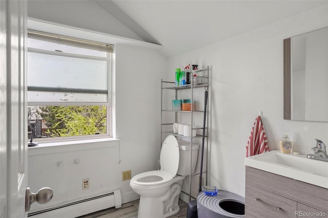2087 S Grant St, Denver, CO 80210 - half bath with toilet, a baseboard radiator, vanity, and vaulted ceiling