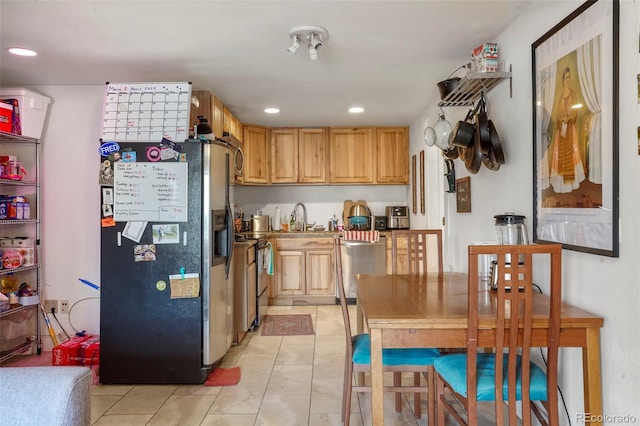 2087 S Grant St, Denver, CO 80210 - kitchen featuring appliances with stainless steel finishes, light tile patterned floors, light brown cabinets, and recessed lighting