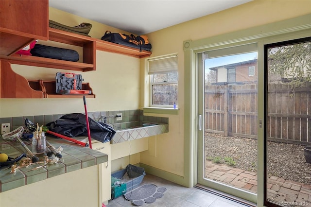 2087 S Grant St, Denver, CO 80210 - laundry area with light tile patterned floors