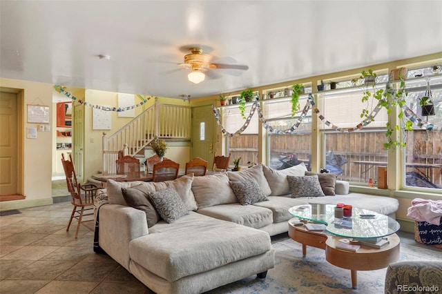 2087 S Grant St, Denver, CO 80210 - living room with stairway, ceiling fan, stone tile floors, and a healthy amount of sunlight