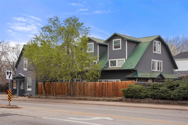 2087 S Grant St, Denver, CO 80210 - exterior space with a gambrel roof, metal roof, and fence