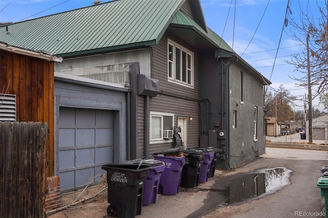 2087 S Grant St, Denver, CO 80210 - view of side of home featuring a garage and metal roof