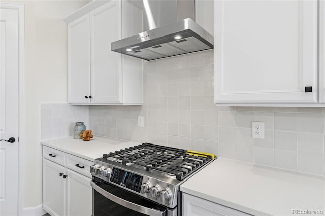 5970 S Platte Canyon Dr, Littleton, CO 80123 - kitchen featuring gas stove, wall chimney exhaust hood, white cabinetry, light countertops, and backsplash