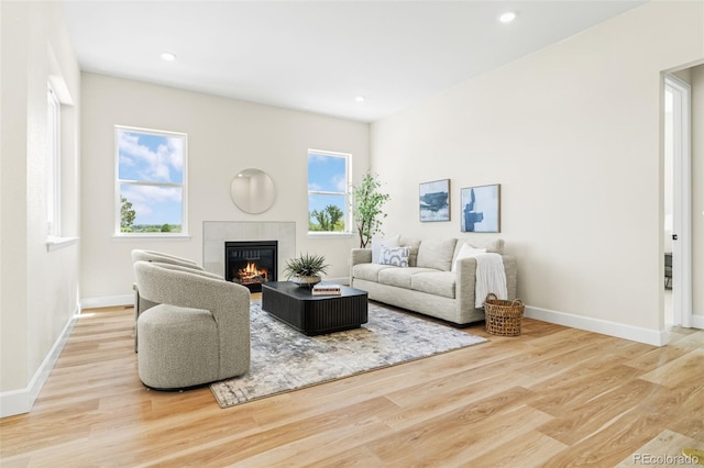 5970 S Platte Canyon Dr, Littleton, CO 80123 - living room featuring a tile fireplace, wood finished floors, baseboards, and recessed lighting