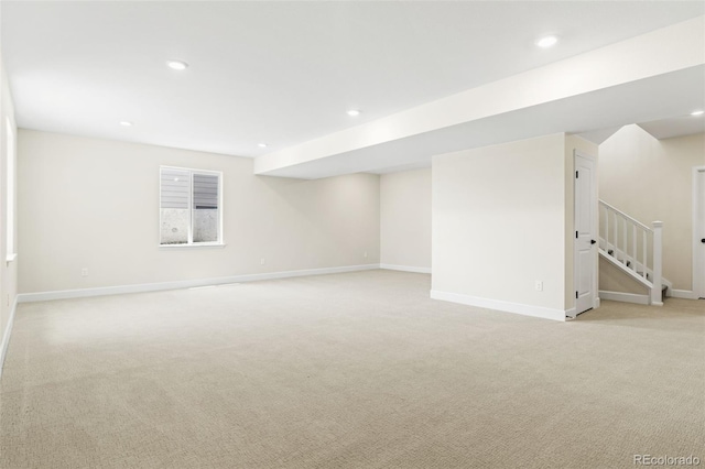 5970 S Platte Canyon Dr, Littleton, CO 80123 - basement featuring light carpet, baseboards, recessed lighting, and stairway