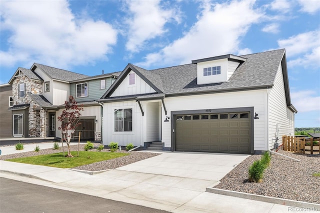 5970 S Platte Canyon Dr, Littleton, CO 80123 - view of front of house featuring board and batten siding, concrete driveway, an attached garage, and roof with shingles