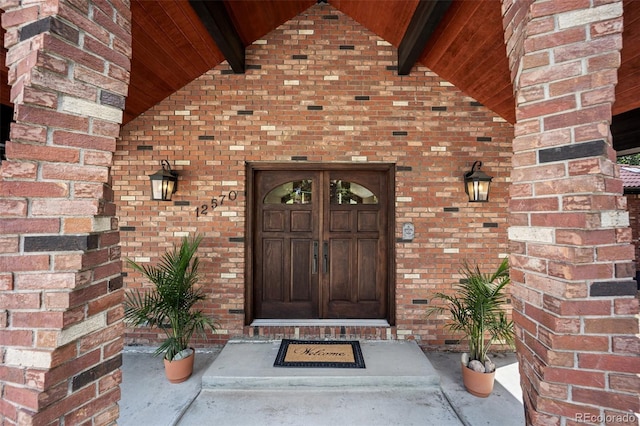 12570 W 60th Ave, Arvada, CO 80004 - doorway to property featuring brick siding