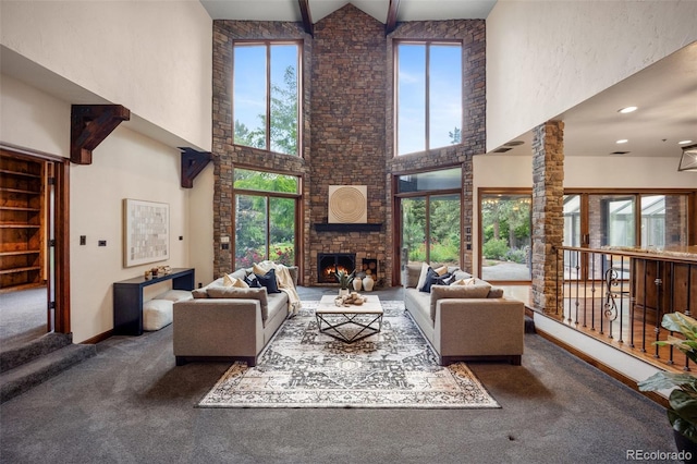 12570 W 60th Ave, Arvada, CO 80004 - living area with high vaulted ceiling, carpet flooring, a fireplace, beamed ceiling, and baseboards