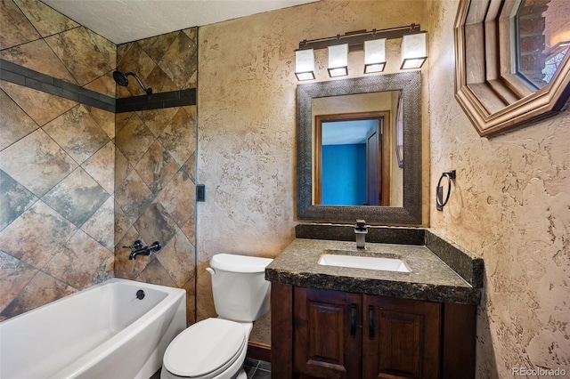 12570 W 60th Ave, Arvada, CO 80004 - bathroom featuring vanity, toilet, bathtub / shower combination, and a textured wall