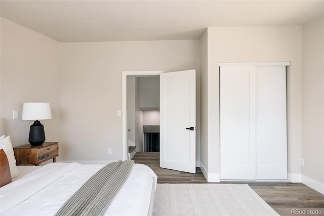 bedroom featuring hardwood / wood-style flooring and a closet