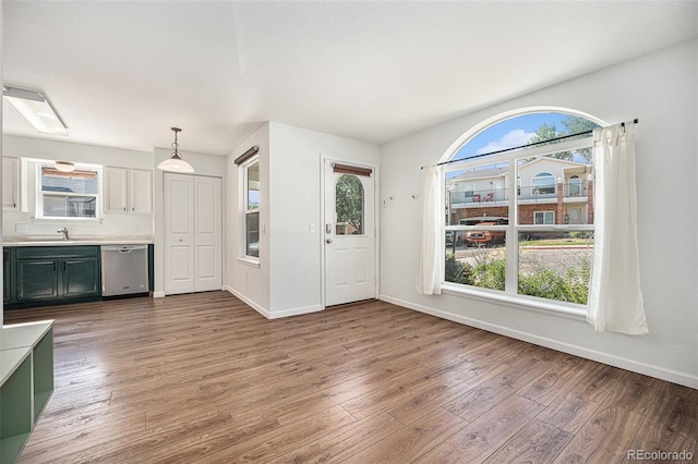 foyer entrance featuring sink and hardwood / wood-style floors