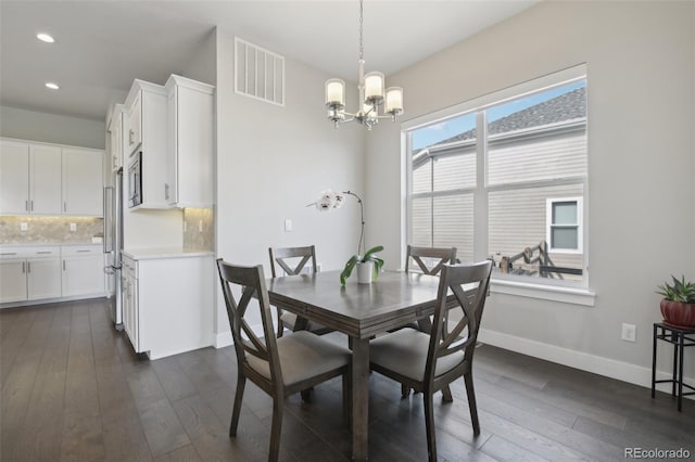 8803 Antero Ct, Arvada, CO 80007 - dining room with a chandelier, dark wood-style floors, recessed lighting, and baseboards