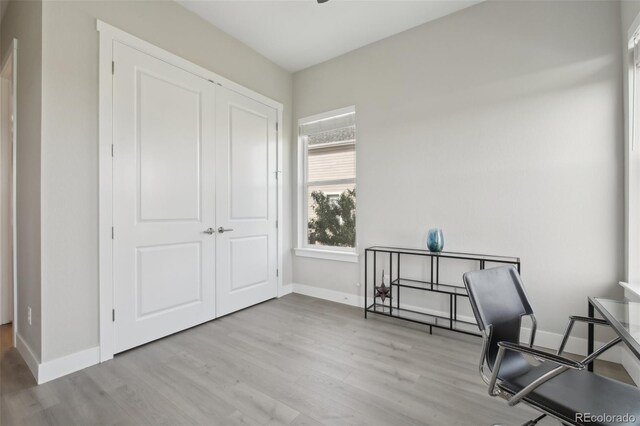 8803 Antero Ct, Arvada, CO 80007 - sitting room with wood finished floors and baseboards