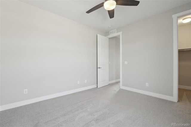 8803 Antero Ct, Arvada, CO 80007 - unfurnished bedroom featuring a spacious closet, carpet floors, baseboards, and a ceiling fan