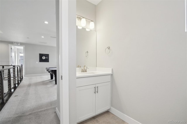 8803 Antero Ct, Arvada, CO 80007 - bathroom with baseboards, vanity, and recessed lighting