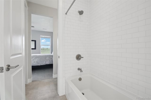 8803 Antero Ct, Arvada, CO 80007 - ensuite bathroom featuring bathtub / shower combination and tile patterned flooring