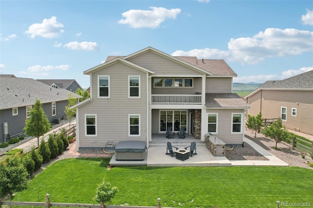 8803 Antero Ct, Arvada, CO 80007 - back of property with a patio area and a hot tub