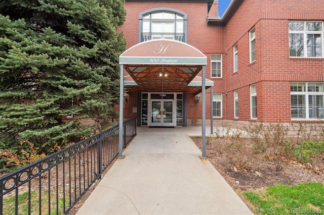 300 Hudson St Unit 109, Denver, CO 80220 - doorway to property featuring french doors and brick siding