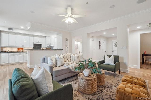 300 Hudson St Unit 109, Denver, CO 80220 - living area featuring light wood finished floors, ceiling fan, crown molding, baseboards, and recessed lighting