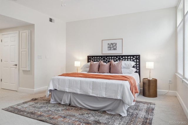 300 Hudson St Unit 109, Denver, CO 80220 - bedroom with carpet floors, multiple windows, and baseboards