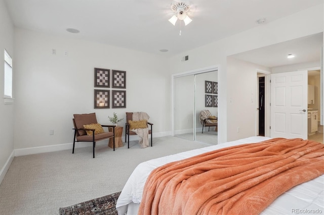 300 Hudson St Unit 109, Denver, CO 80220 - bedroom featuring light colored carpet, a closet, and baseboards
