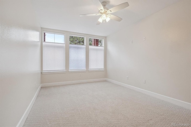 300 Hudson St Unit 109, Denver, CO 80220 - empty room featuring a ceiling fan, baseboards, and light colored carpet