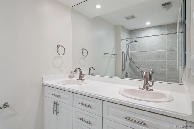 300 Hudson St Unit 109, Denver, CO 80220 - full bath featuring double vanity and tiled shower