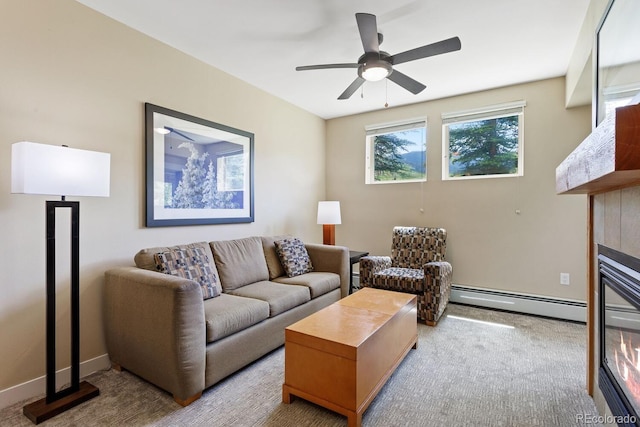 carpeted living room featuring baseboard heating and ceiling fan