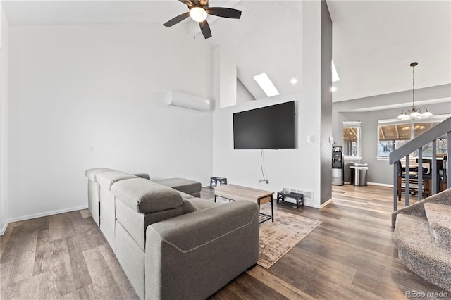 12119 Forest St, Thornton, CO 80241 - living room featuring lofted ceiling, a chandelier, a ceiling fan, a wall mounted AC, and recessed lighting