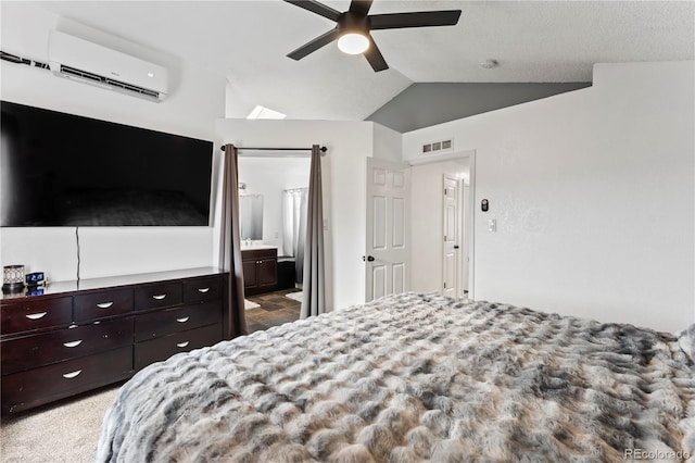 12119 Forest St, Thornton, CO 80241 - bedroom featuring a wall unit AC, lofted ceiling, ensuite bathroom, a ceiling fan, and carpet flooring