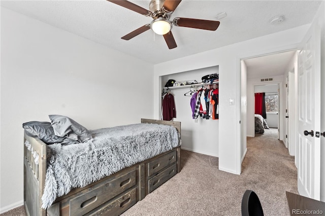 12119 Forest St, Thornton, CO 80241 - bedroom with carpet floors, a closet, baseboards, and ceiling fan