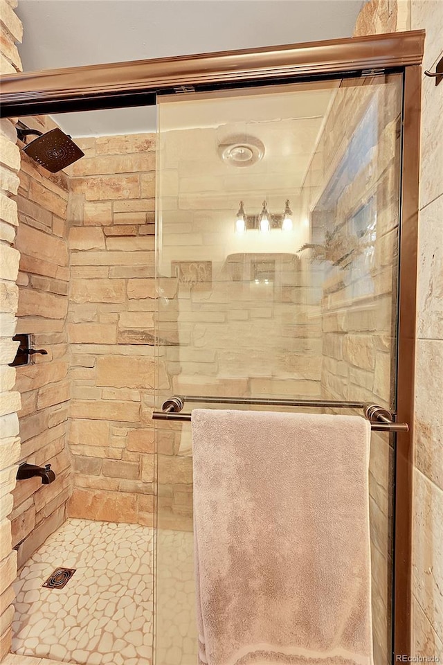 full bathroom featuring a shower stall