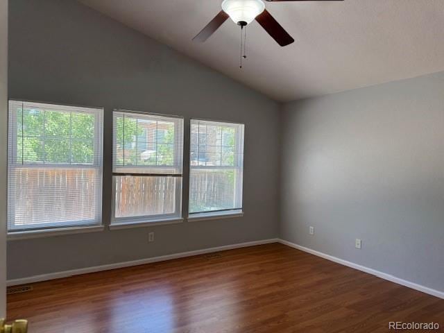 20148 E Dartmouth Dr, Aurora, CO 80013 - unfurnished room featuring vaulted ceiling, plenty of natural light, a ceiling fan, and wood finished floors