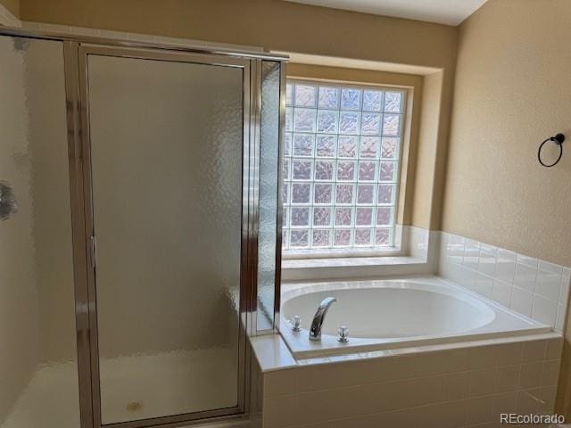 20148 E Dartmouth Dr, Aurora, CO 80013 - full bathroom with a bath and a stall shower